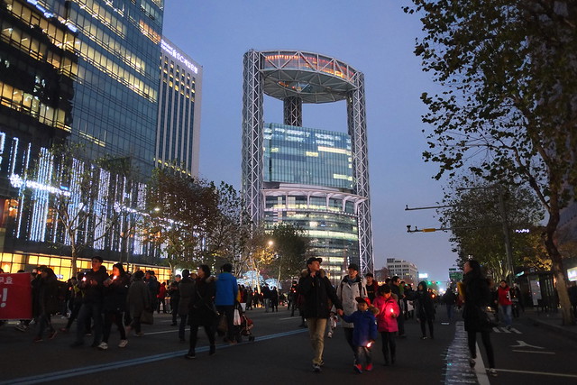 Seoul Korea Kwanghwamun candle rally December 2016 with skyscraper backdrop - 