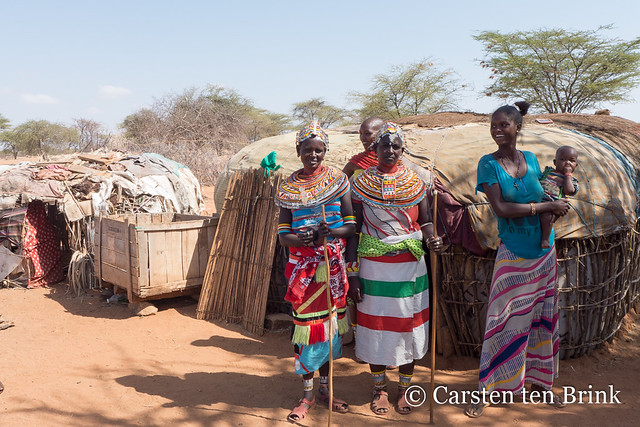 Samburu women by their huts [bc1492]