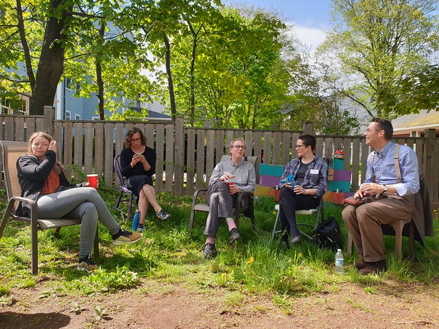 The future of blogging session with five of the participants sitting in chairs outside in Peter’s back yard