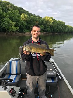Rick Norris holds up a beautiful upper Potomac smallmouth bass for a quick photo.