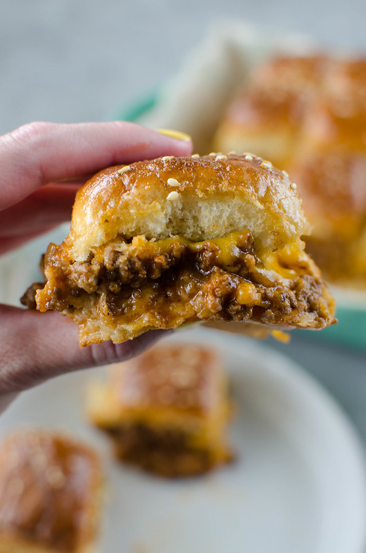 Sloppy Joe Sliders - an easy way to serve sloppy joes to a crowd! Sloppy joe meat and cheese on Hawaiian rolls and covered in the most delicious glaze. Great for a weeknight dinner, a party, or tailgating! 