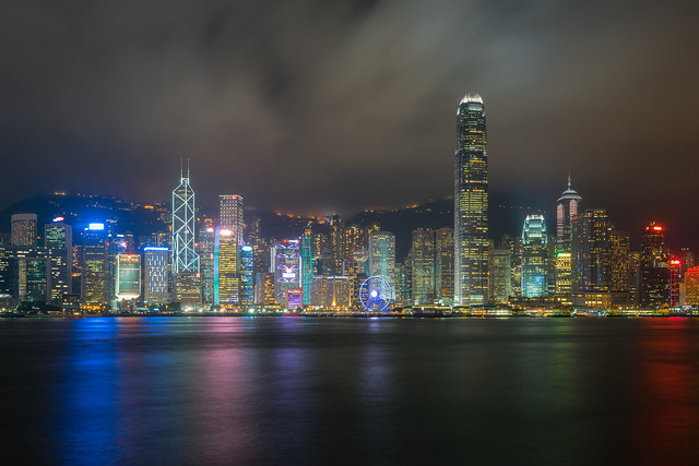 Hong Kong City skyline at night. View from across Victoria Harbor Hong Kong.