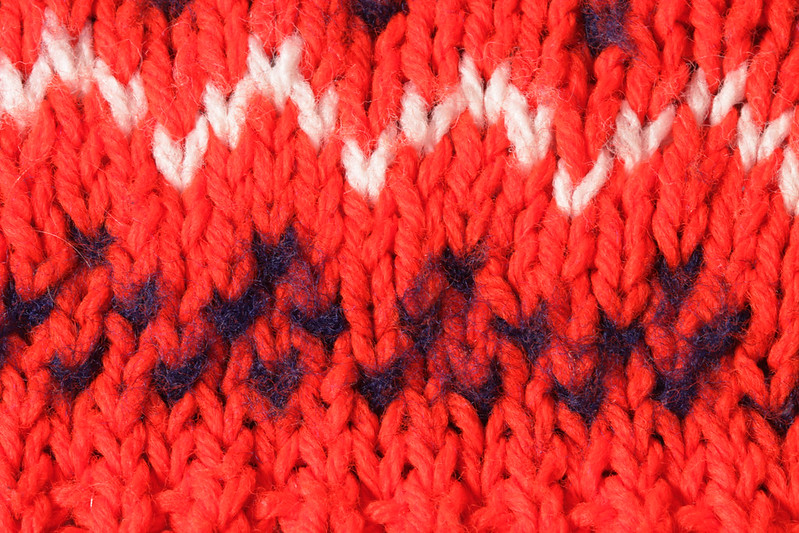 close up of wear on fair isle knitting in acrylic yarn