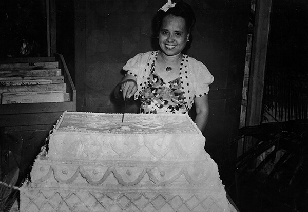 Agueda I. Johnston cutting cake at first Guam Liberation celebration. Photo courtesy of the Micronesian Area Research Center (MARC).