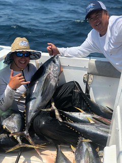 Photo of men with yellowfin tuna they caught 
