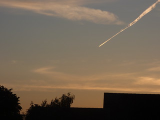 Sunset over Sudbury - fiery plane trail