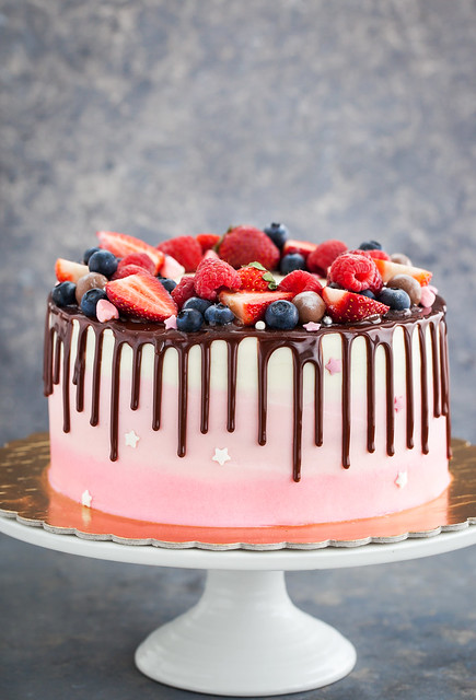 Delicious homemade cake decorated with chocolate and  fresh berries