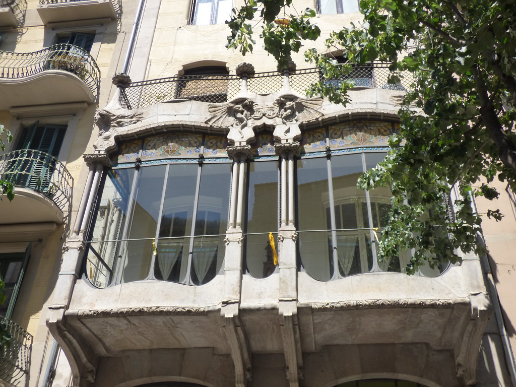 Rambla de la Llibertat, Girona - windows and sculptures near apartments