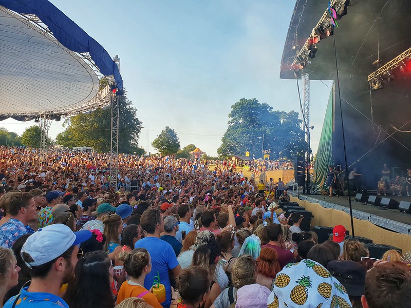 A crowd of people at the Atrium stage at Wilderness Festival