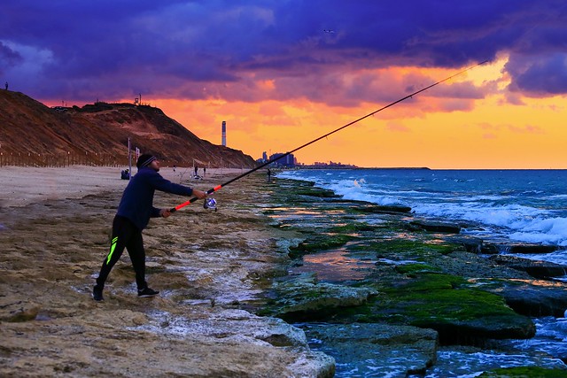 Fisherman at sunset - Tel-Aviv beach