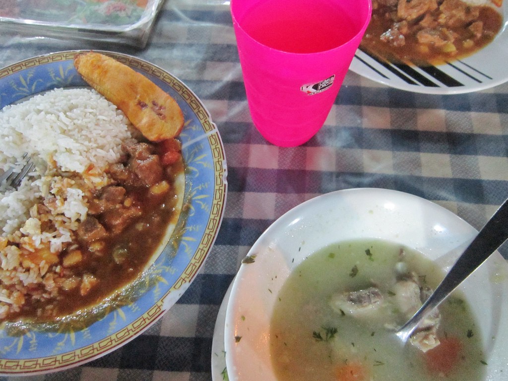 Plate of rice and stew plus a bowl of soup - a menu del dia in Galapagos, Ecuador