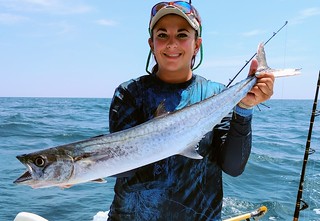 Photo of woman holding king mackerel