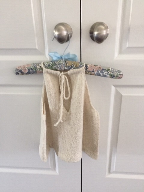 By Megan Nodecker from Knit Scene Magazine for my daughter. I used Berrocco Remix Light in Birch. It is hemmed using a picot edge and I-cord tie through casings in front and back!  Knit By Rosemary Mulligan