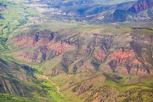 mountains colorado rockies rockymountains peaks trees road valley maroon sediment layers landscape windowsit plane passengerplane passengerjet aerial