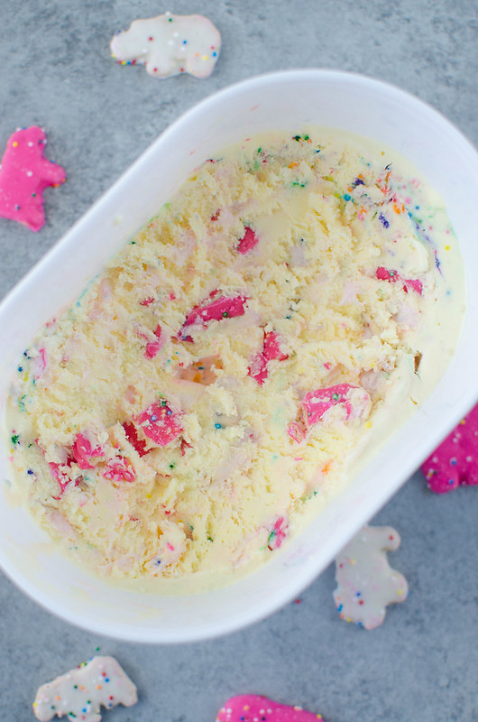 Circus Animal Cookie Ice Cream - homemade vanilla ice cream with frosting swirls, chopped circus animal cookies, and sprinkles. Such a fun treat for summer!