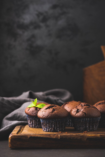 Chocolate Muffins In Paper Cups, Black Background