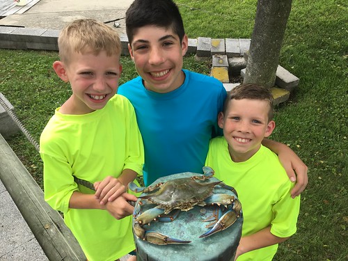 Photo of boys with a jumbo blue crab