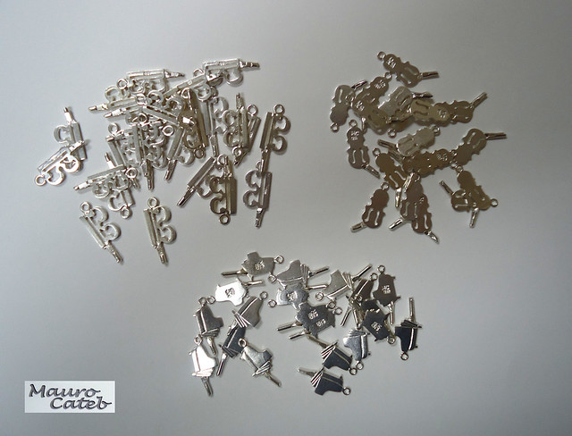 Silver charms with sprues