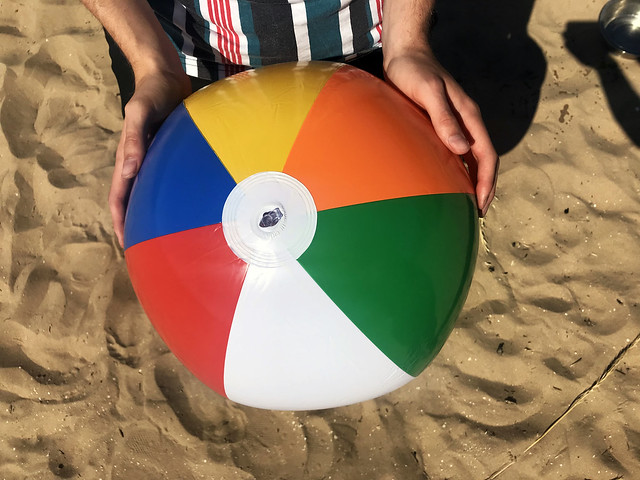 Beach ball in the sand stock photo image