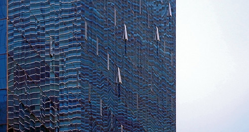 Glass wall reflection of a high-rise building in Mexico City