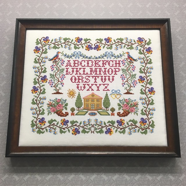 Cross stitch sampler by one of our talented customers - blocked, stretched with batting, and custom framed in a moulding from Larson-Juhl’s “Intermezzo” collection.