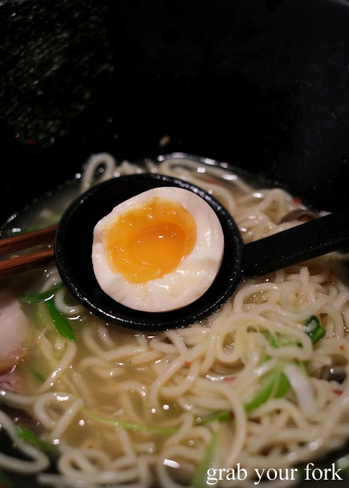 Runny yolk inside the ajitama seasoned boiled egg at Crescent Ramen Bar in a Japanese hostess bar in a Sydney basement