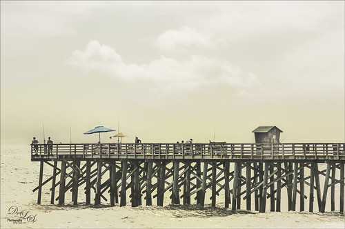 Image of people fishing on the Flagler Beach Pier in Florida. 