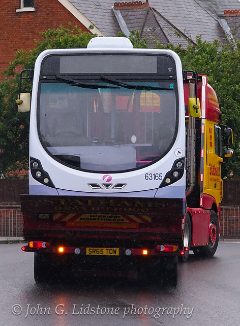 After being struck by a flying Ford Ka after a nearby RTA, First Essex (Hadleigh) Wright StreetLite DF 63165 is taken away back to Wrightbus at Ballymena for major repairs