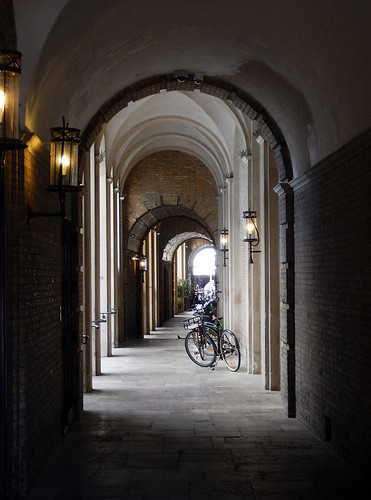 Bikes beneath an arched colonnade in Copenhagen, Denmark