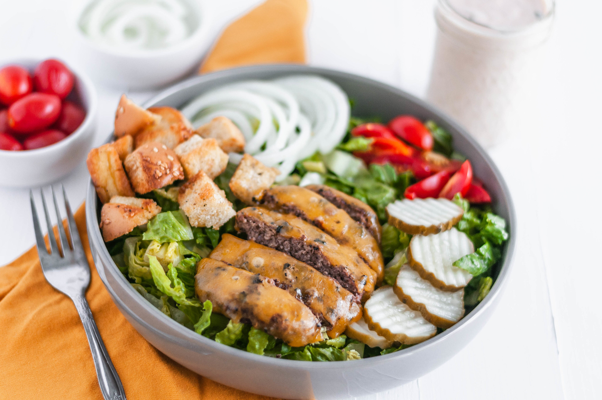 Lighten up your favorite summer main dish with this Cheeseburger Salad. All the delicious flavors from a cheeseburger atop a big bed of lettuce.