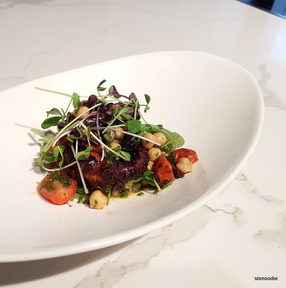 Grilled octopus with chickpeas, tomatoes, and arugula salad