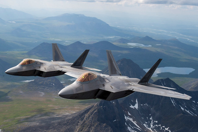 F-22 Raptors fly in formation over the Joint Pacific Alaska Range Complex