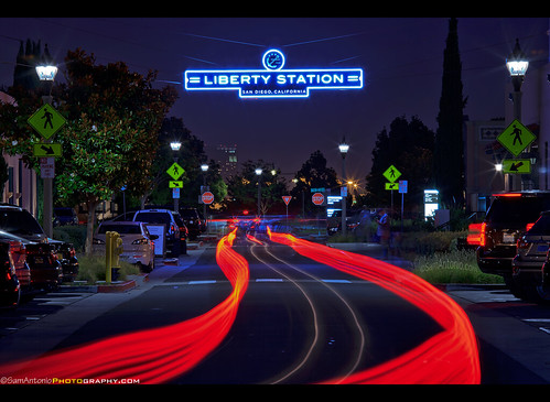 california road street urban sign night neon view traffic sandiego scene transportation pointloma libertystation auto longexposure travel blue light architecture speed buildings evening movement twilight automobile downtown cityscape dusk unitedstatesofamerica scenic illumination dramatic architectural historic trail infrastructure lighttrails lamps metropolitan lightstreaks lampposts urbanscene