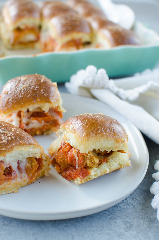 Chicken Parmesan Sliders - hawaiian rolls layered with crispy chicken strips, marinara, 2 kinds of cheeses, and topped with a garlicky butter glaze! Easy weeknight dinner or perfect for a party.