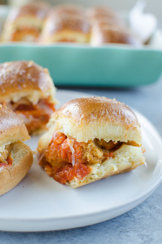 Chicken Parmesan Sliders - Hawaiian rolls layered with crispy chicken strips, marinara, 2 kinds of cheeses, and topped with a garlicky butter glaze! Easy weeknight dinner or perfect for a party.