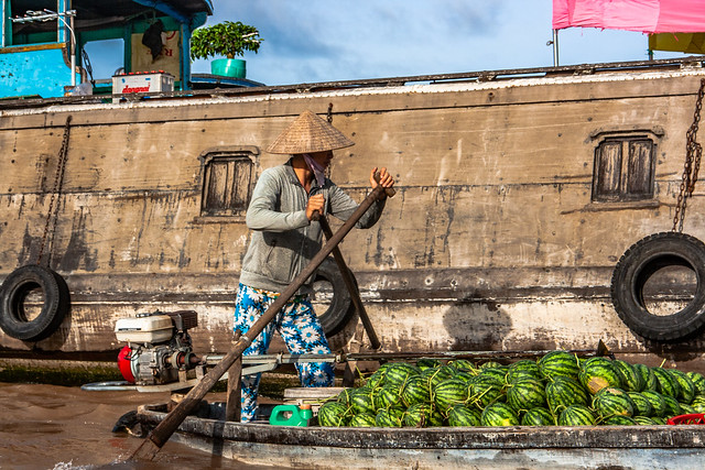 Watermelon seller at Cai Rang Floating Market in Can Tho Vietnam.