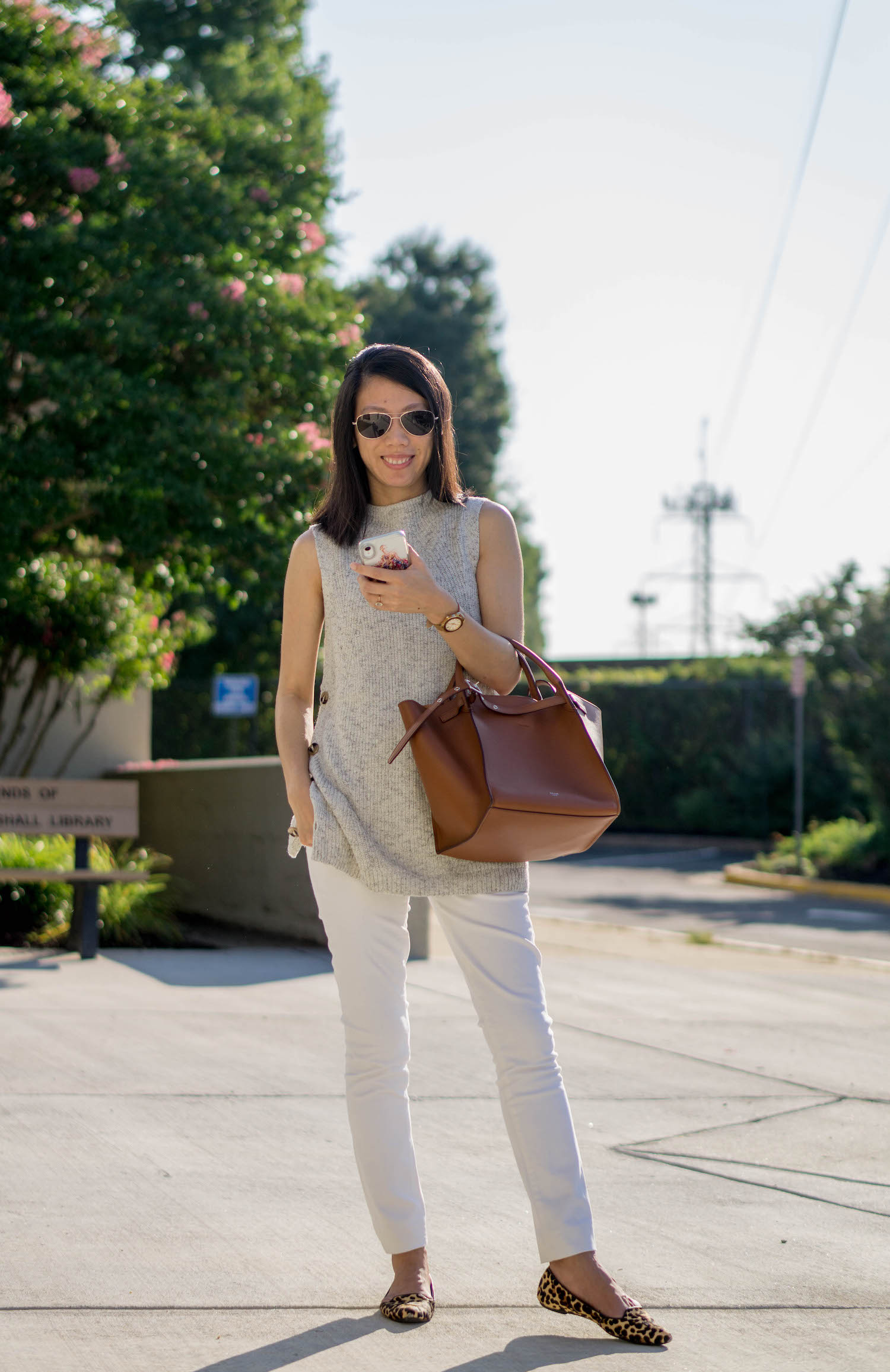 Ann Taylor ribbed mock neck sleeveless tunic sweater, Tory Burch Whitney leather strap watch in 35mm, J.Crew Factory 8" midrise skinny jean in white denim with 30" inseam, Celine small big bag, Nine West leopard flats