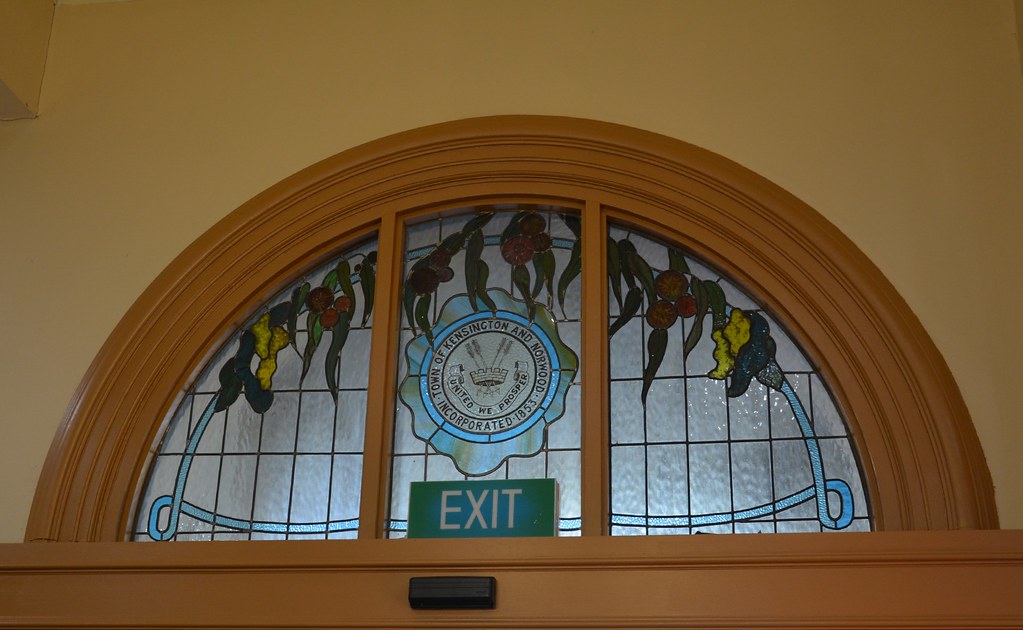 Norwood Town Hall of 1883 stained glass window above the entrance on The Parade / with motto and coat of arms of the Town of Kensington and Norwood, incorporated 1853. South Australia