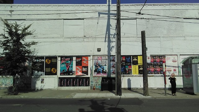Postered wall #toronto #ossingtonave #ossingtonstrip #queenwestselfstorage #posters #white #wall