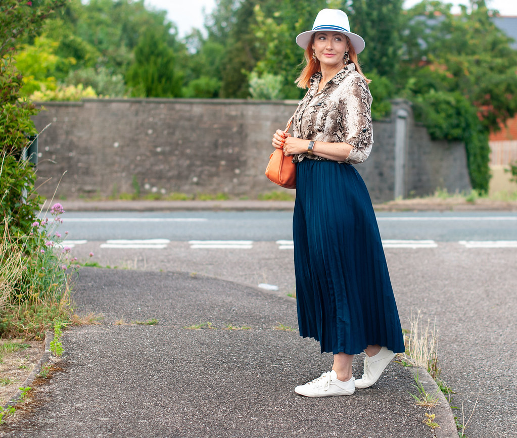 Why a Pleated Maxi With Sneaks is a Failsafe Summer Outfit \ snakeskin print shirt \ navy pleated maxi skirt \ white fedora \ white sneaks \ orange shoulder bag | Not Dressed As Lamb, over 40 fashion