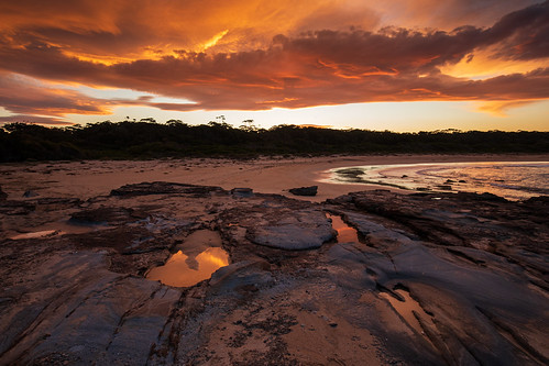 southdurras nsw australia sunset beach rocks reflections