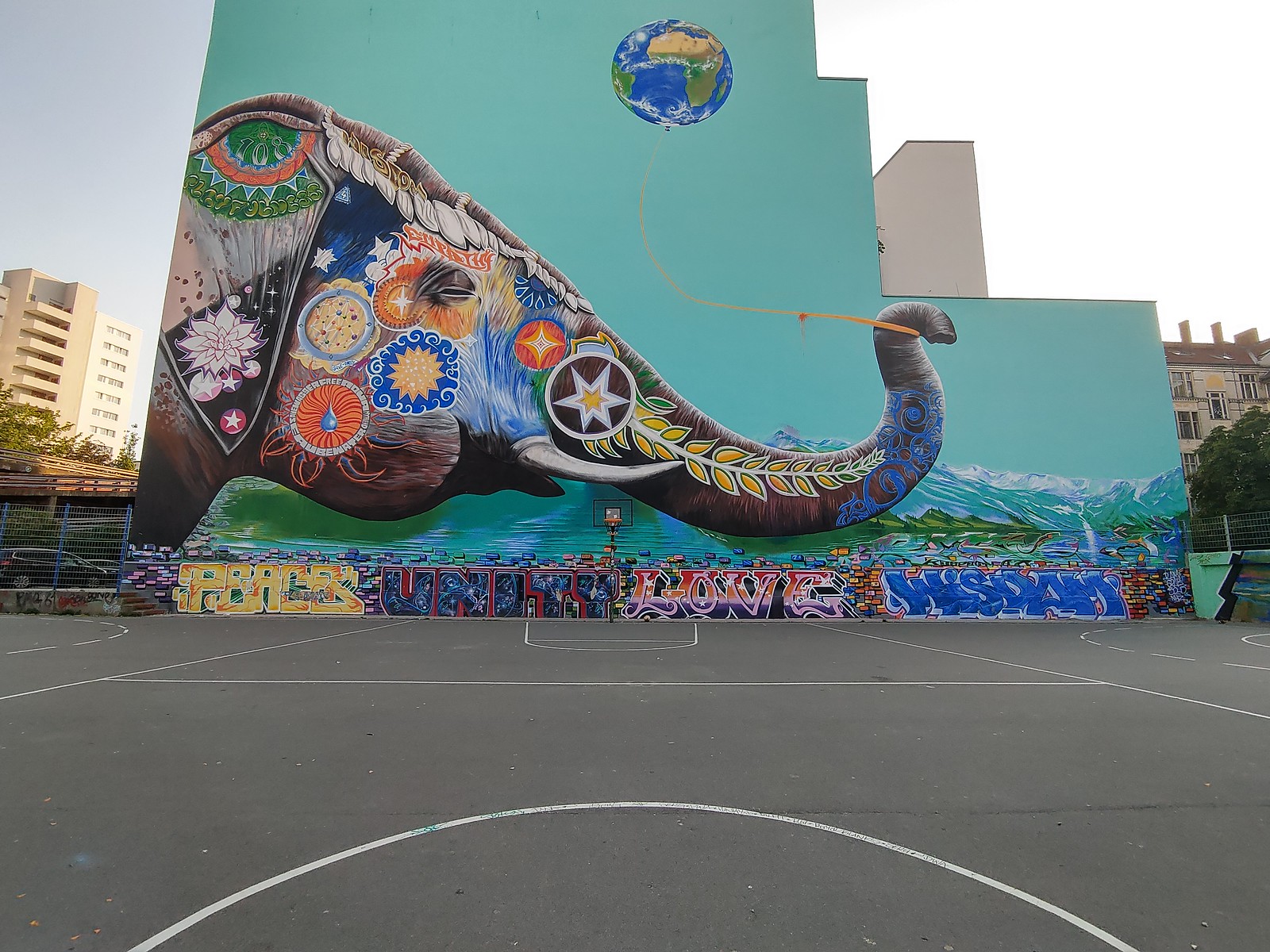 Elephant Playing With a World Balloon