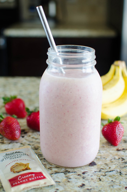 PB&J Smoothie - the classic peanut butter and jelly as a healthy smoothie! Fresh banana, strawberries, milk, and peanut butter make a delicious, protein packed breakfast or snack!