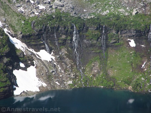 Waterfalls tumbling down into Hidden Lake in Glacier National Park, Montana