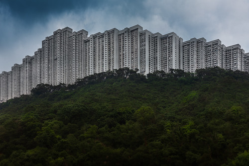 wonderland villas apartments flats hong kong kowloon daylight stacke buildings jungle forest hilltop wall