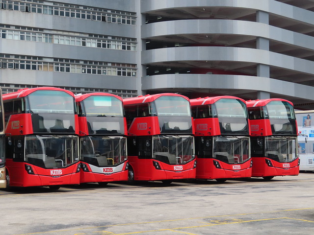 The KMB only Wright Streetdeck is hidden among the new Wright Gemini 3 bodied Volvo B8Ls at Kowloon Bay Depot .