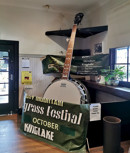 Giant Banjo promoting a blue-grass festival in Kinglake Pub