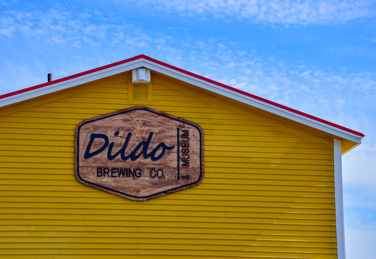 Dildo Brewing Company - yellow building and blue sky