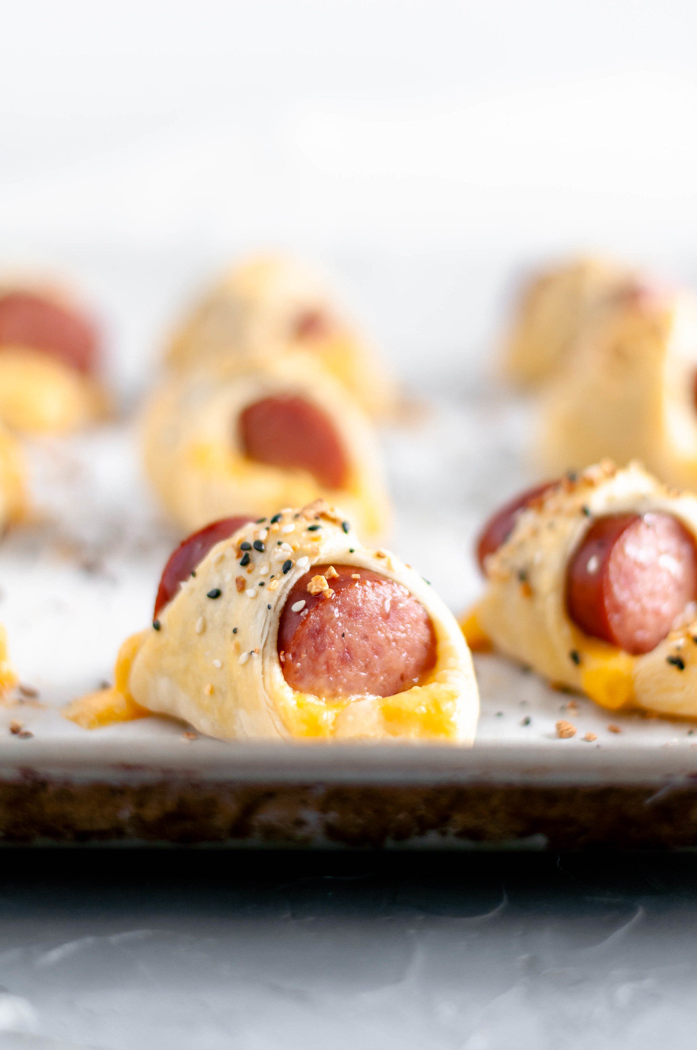 It's almost football season and that means it's time for all the football food and appetizer. Start the game with these Cheesy Pigs in a Blanket.