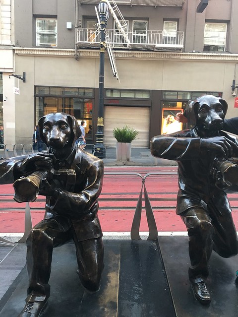 Dog paparazzi sculptures
